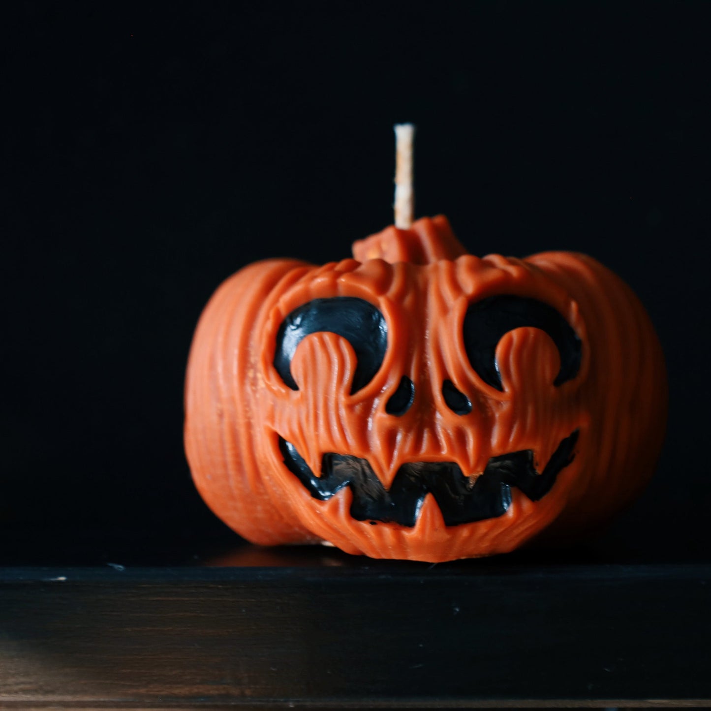 Pumpkin decorative pillar soy candle perfect for Halloween decoration.