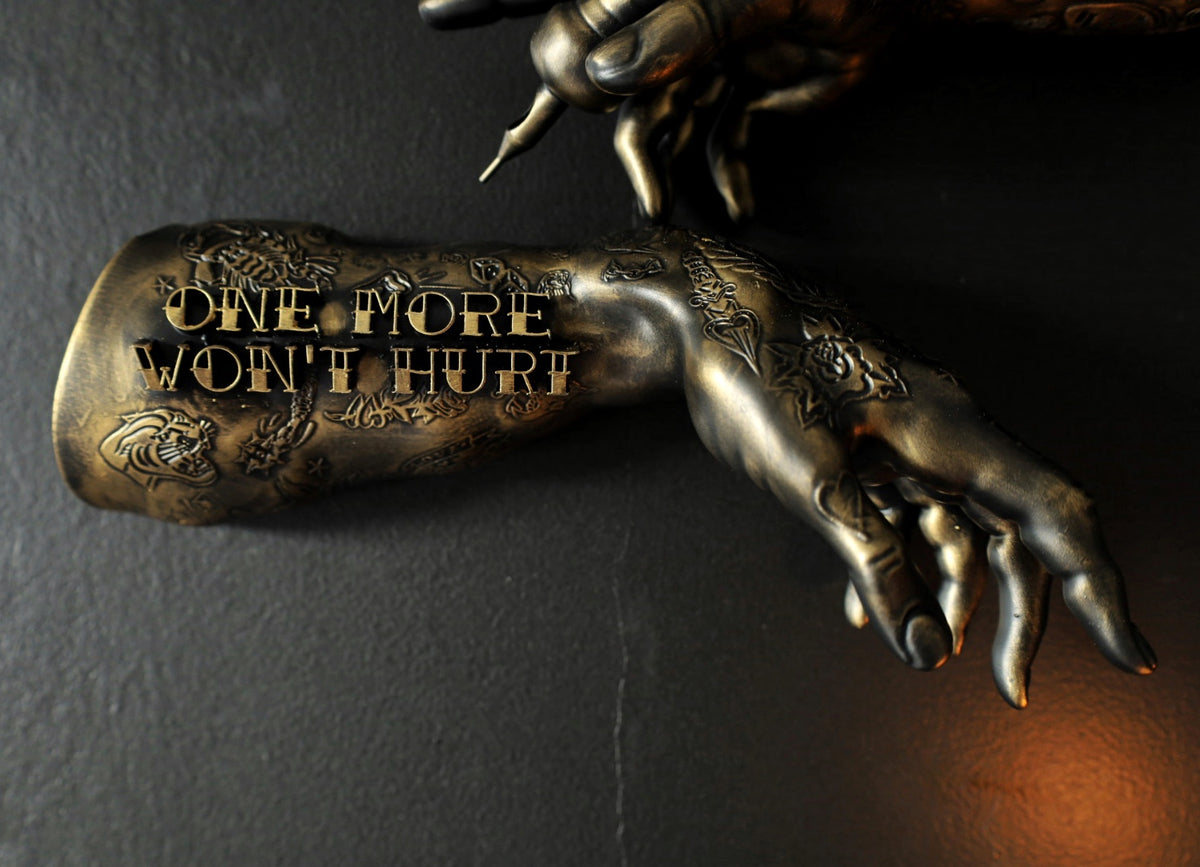 ‘One more won’t hurt’ tattoo arm wall hangings