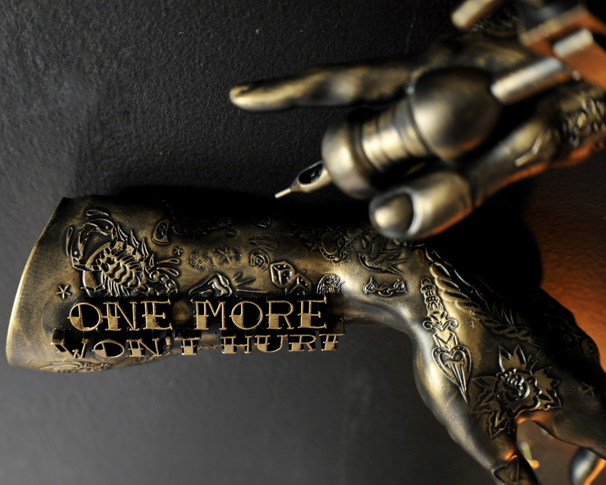 ‘One more won’t hurt’ tattoo arm wall hangings