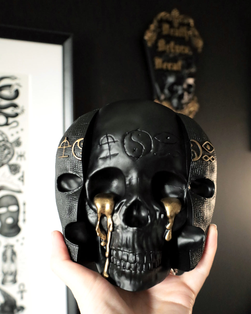 Black and gold skull gothic wall decor with gold tear accents inspired by the band Bad Omens 