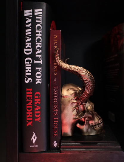Black and gold gothic style skull bookend 