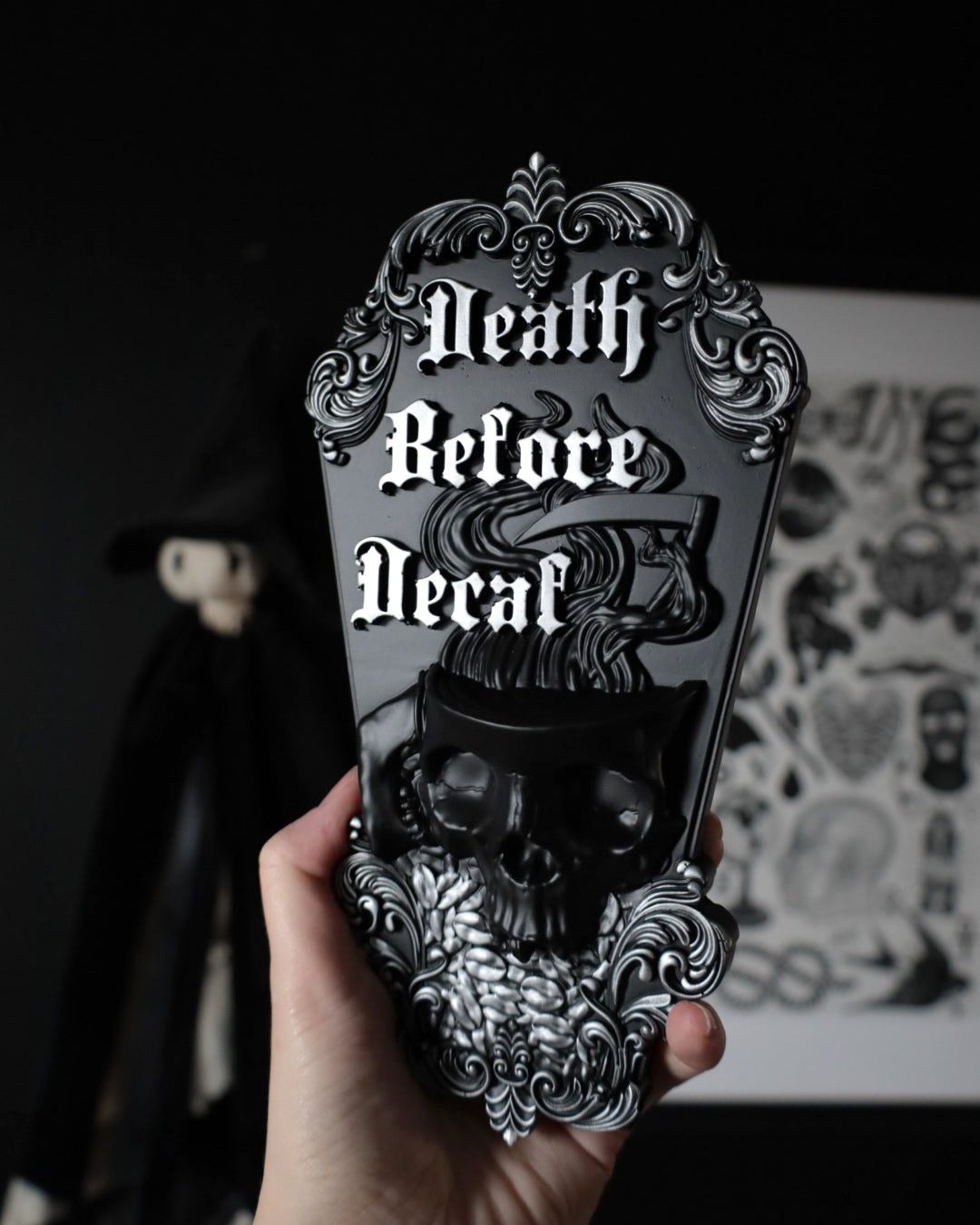 Gothic wall hanging with skull design and 'Death Before Decaf' writing