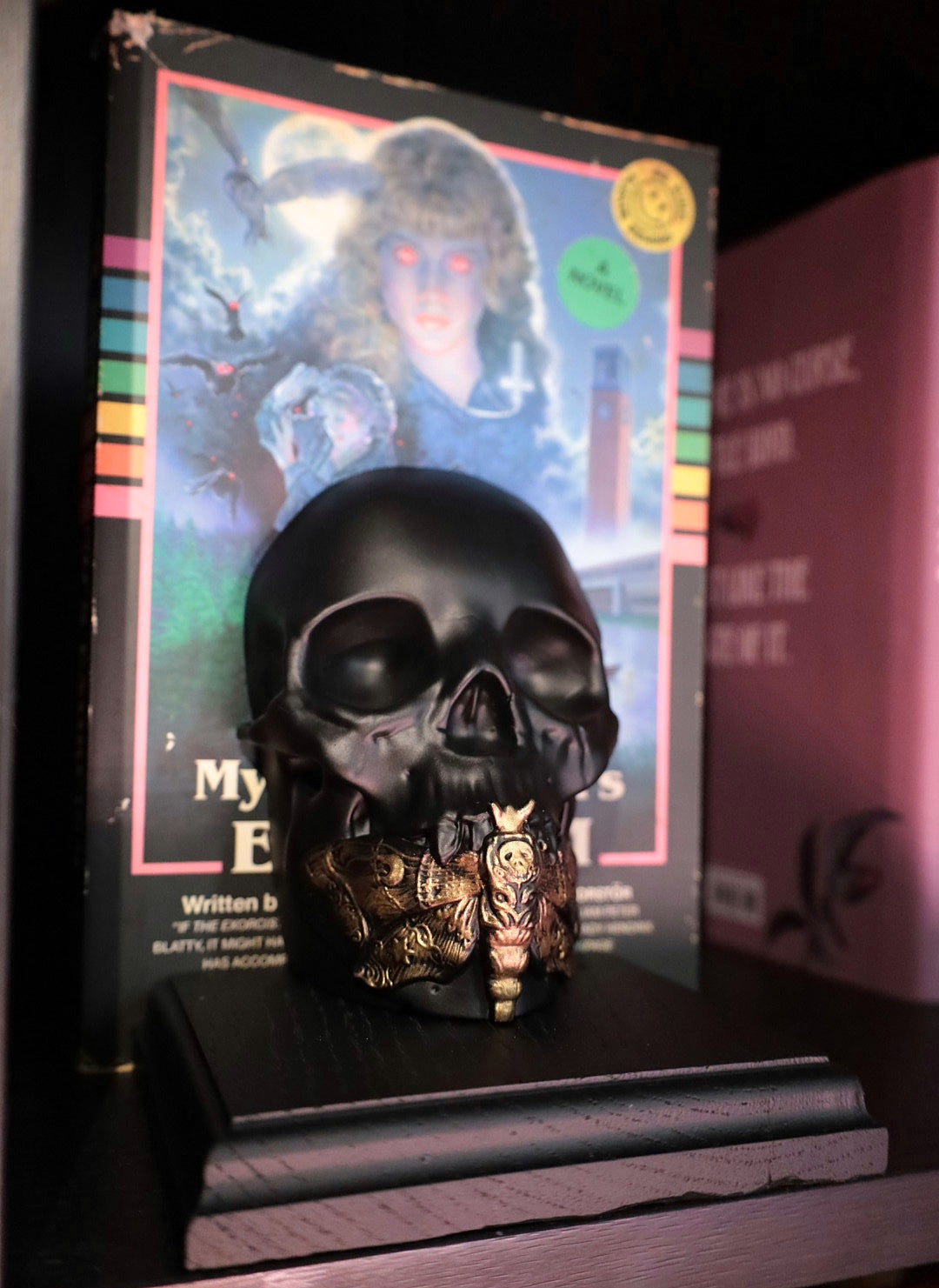 A black and gold bookend in a death moth skull design. Decorate your bookshelf with this gothic style piece.