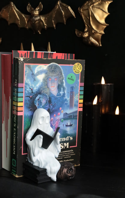 Ghost reading bookend with a pumpkin for your gothic bookshelf  