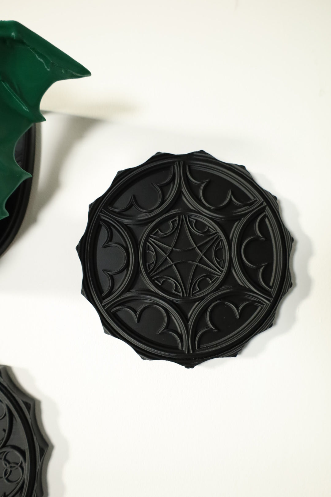 A gothic black wall hanging with intricate gothic window designs inspired by Bring Me The Horizon 