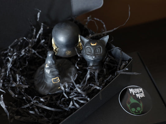 Goth gifts wax melts featuring a black car, pumpkin spice cauldron and witch hat