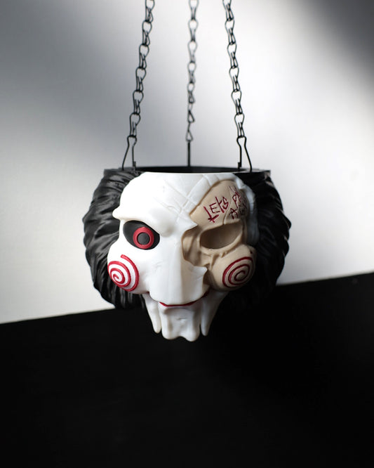 Jigsaw plant pot inspired by horror movie Saw. Halloween horror home decor