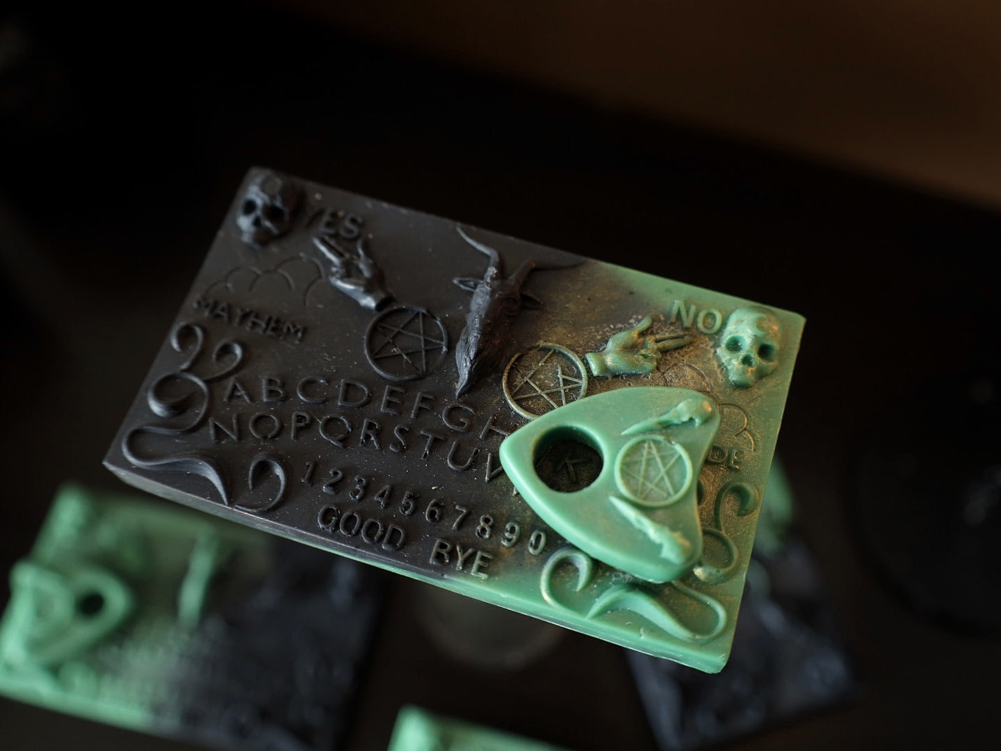 Green and gothic black Ouija board shaped wax melt and would make a great present for a goth.