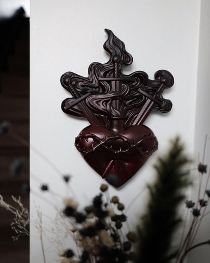Red heart with swords and flames design 