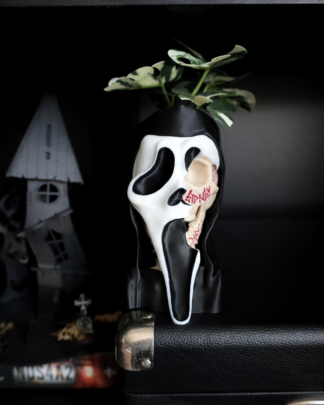 Ghostface from scream desk planter on a shelf 