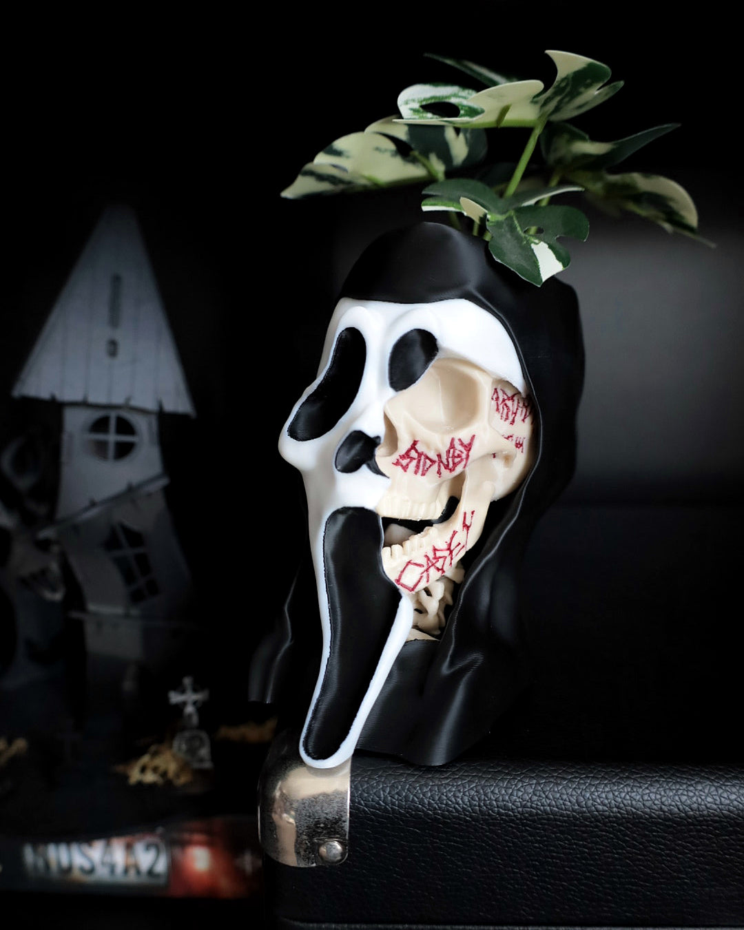 Scream desk planter with plants in the back ground horror 