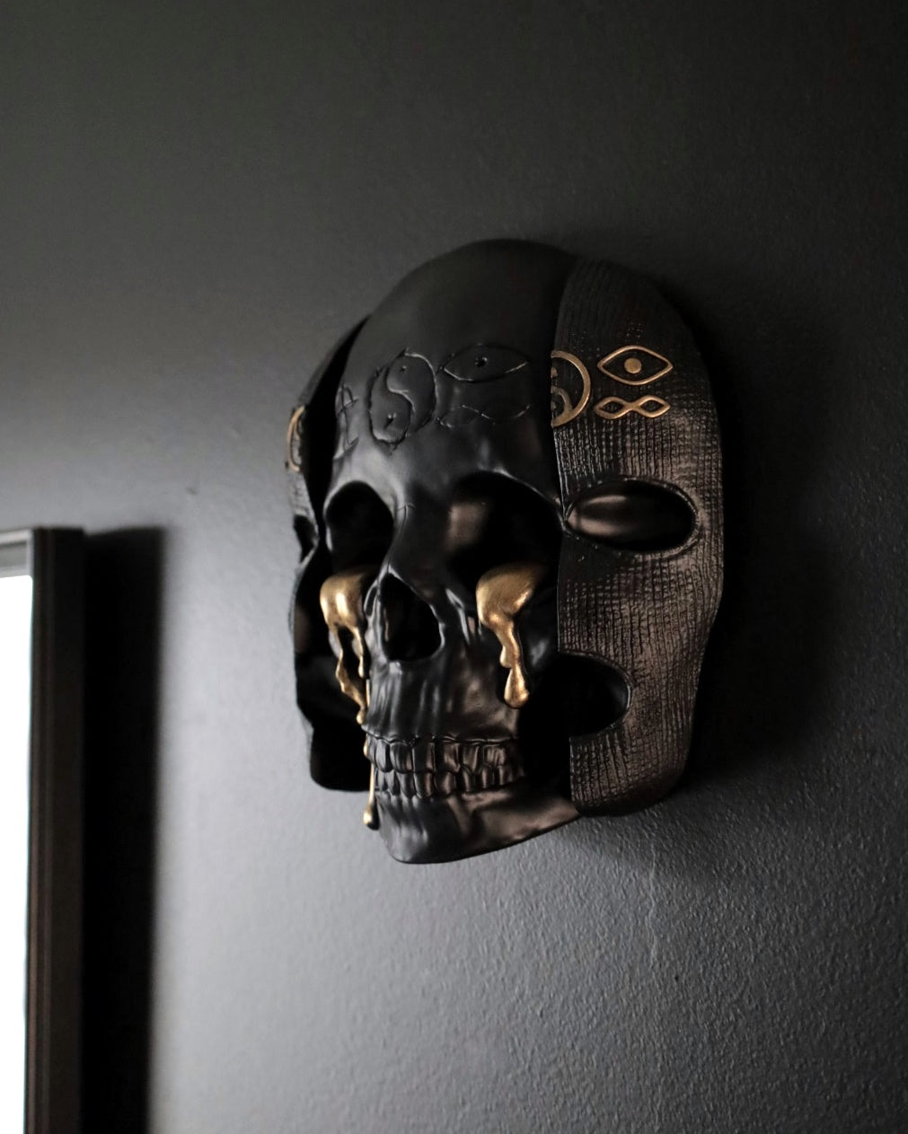 Decorative skull wall art with intricate designs inspired by Bad Omens 