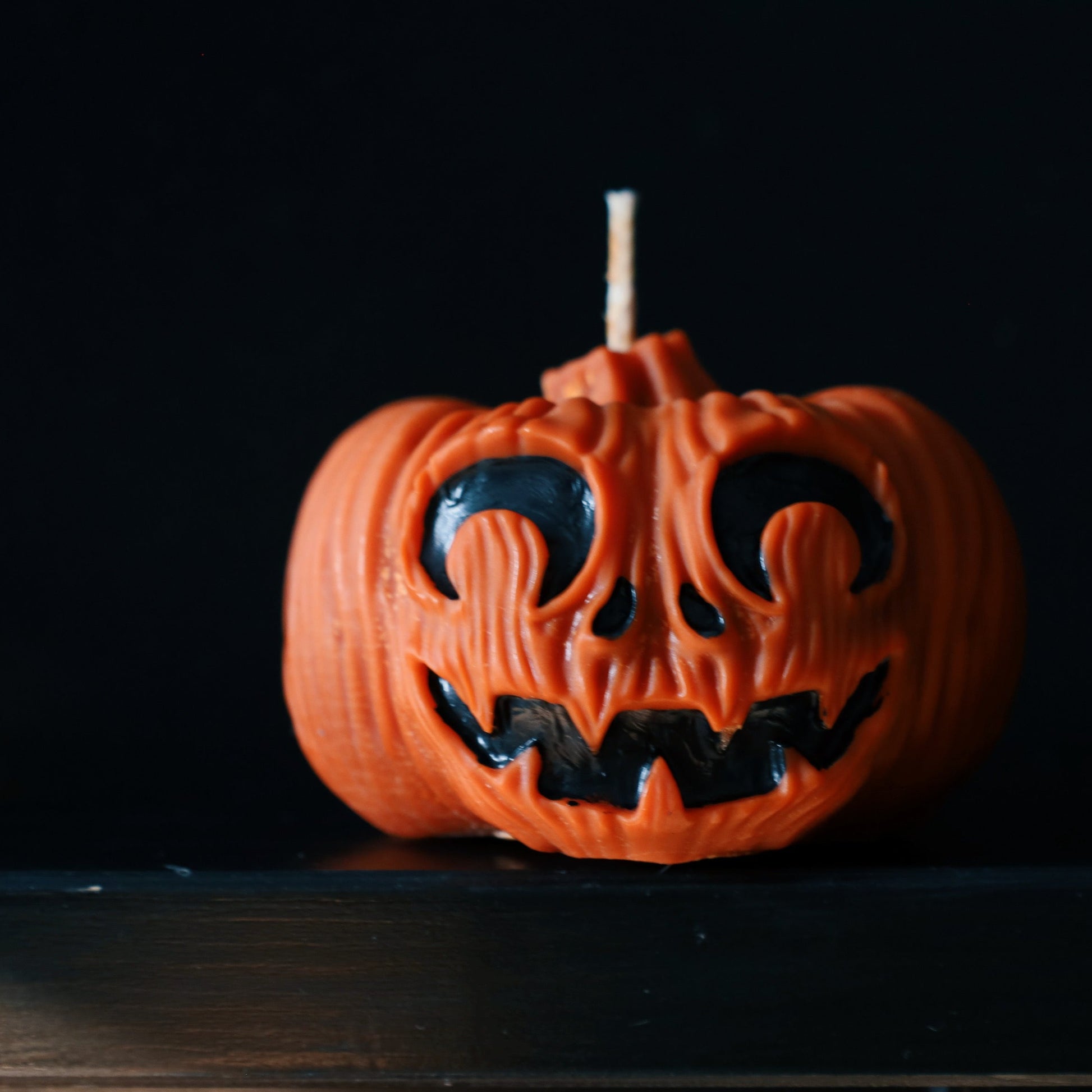 Pumpkin decorative pillar soy candle perfect for Halloween decoration.
