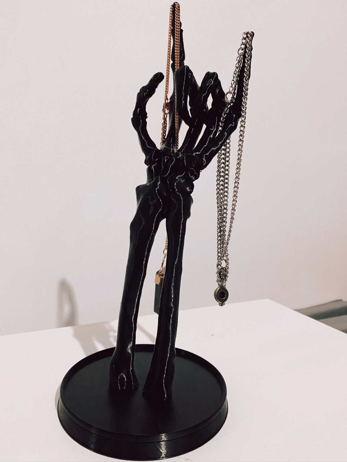 Skeleton hand jewellery hand in a rock pose for displaying jewellery or to put amongst your gothic home decor.