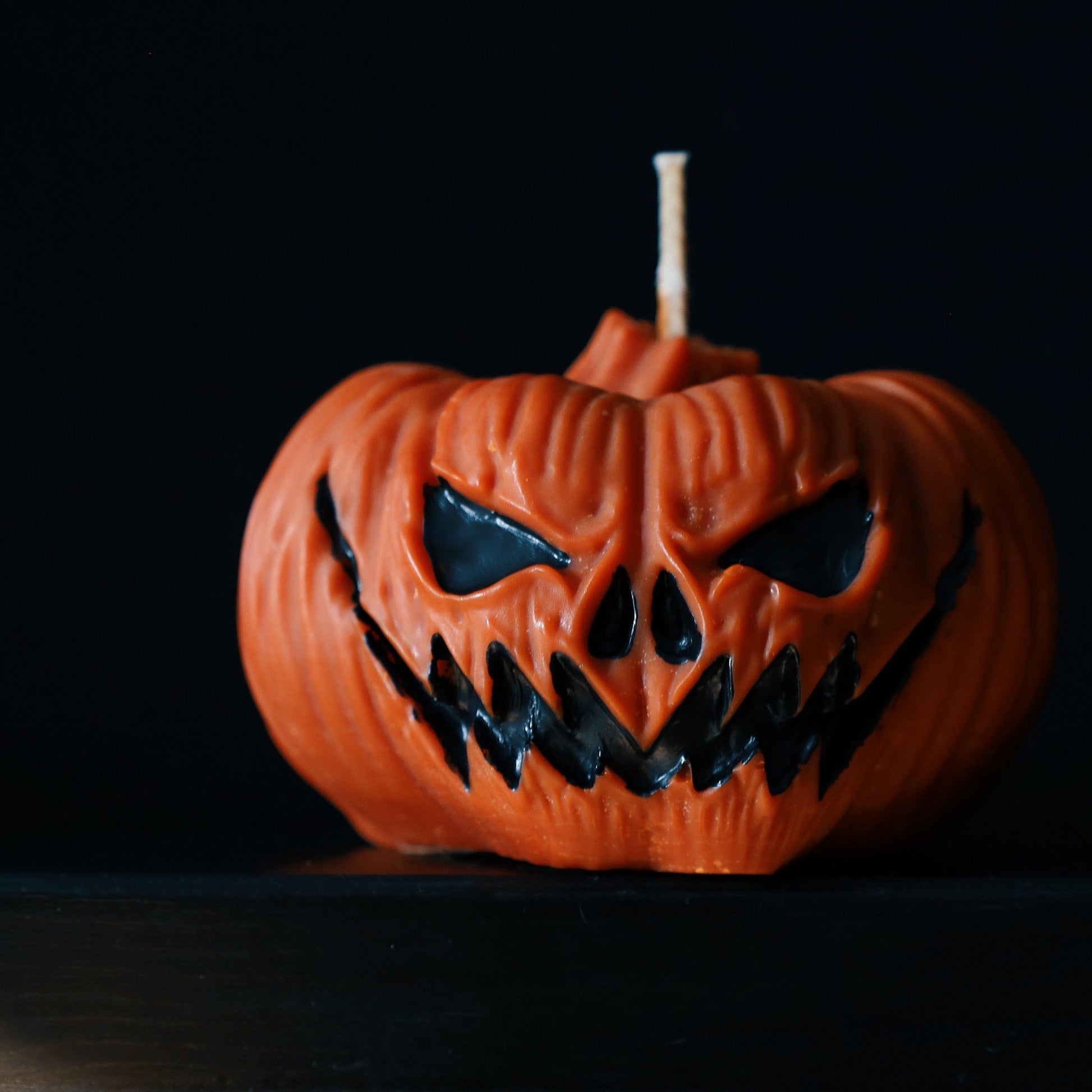 Pumpkin decorative pillar soy candle perfect for Halloween decoration.