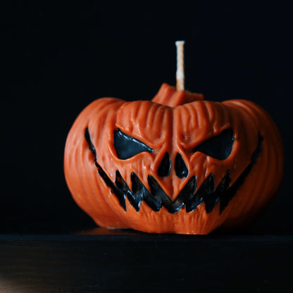 Pumpkin decorative pillar soy candle perfect for Halloween decoration.